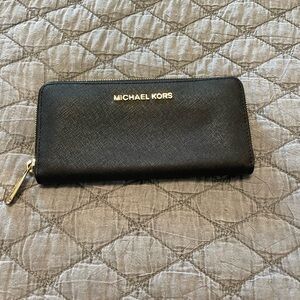 Michael Kors Collection.  Plenty of space for all of your needs.